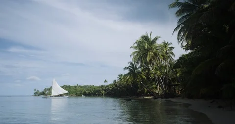 Sail boat setting sail at tropical island with crystal clear water Stock Footage 86102313
