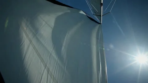 Sail floating in the wind on a beautiful sailboat Stock Footage 27606589