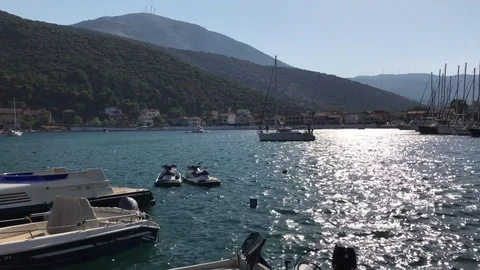 A sail ship leaving the port of Sami at sunset, in Kefalonia, Greece. Stock-Footage 80533020