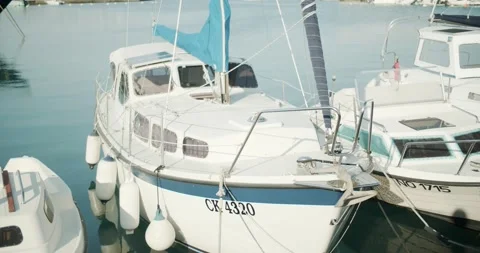 Sailboar in a harbor floating calmly 動画素材 141742387