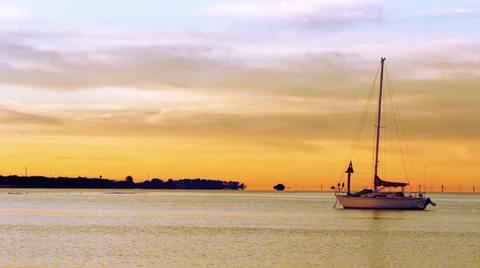 Sailboat against a beautiful orange backdrop sky 스톡 동영상 34668595