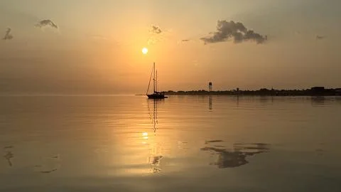 Sailboat and its reflection Stock Photos