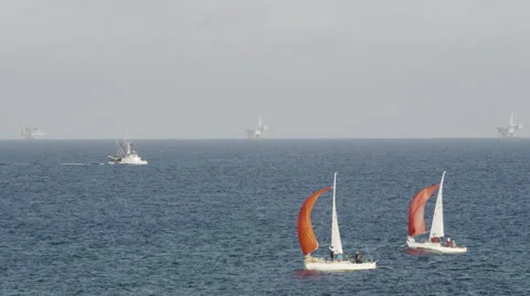 Sailboat and Oil Rigs 4K Stock Video Footage Stock Footage