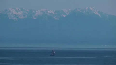 Sailboat and Olympic Mountains Stock Footage 7743830