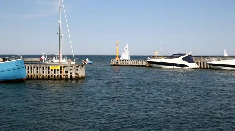 Sailboat approaching harbour Stock Footage 506405