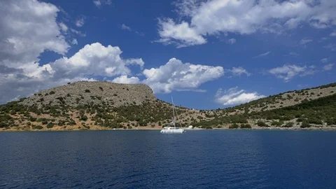 Sailboat on the background of the island. Video stock 103540756