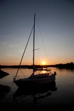 Sailboat with a beautiful sunset Stock Photos