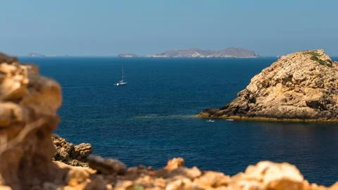 Sailboat between the rocks Stock Photos