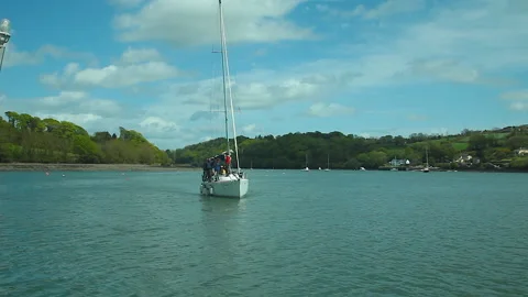 A sailboat coming in to dock Stock Footage 236708529
