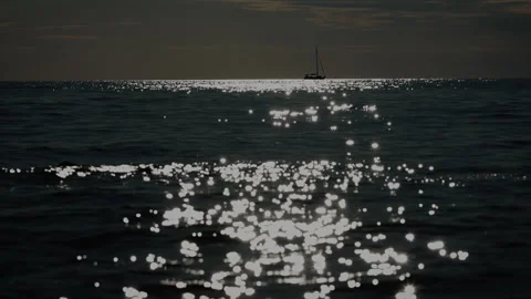 Sailboat Crossing Sunset Path on Gentle Waves Stock Footage 341658861