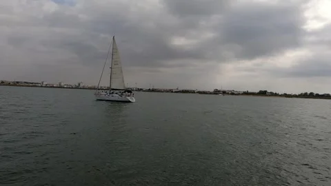 Sailboat cruising down the river Stock Footage 285139254
