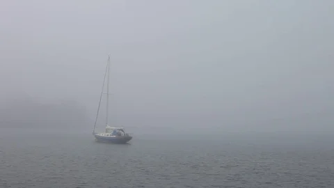 Sailboat floating anchored in the mist Stock Footage 83462479