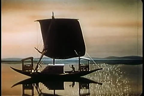 Sailboat floating on shimmering ocean 스톡 동영상 11345302