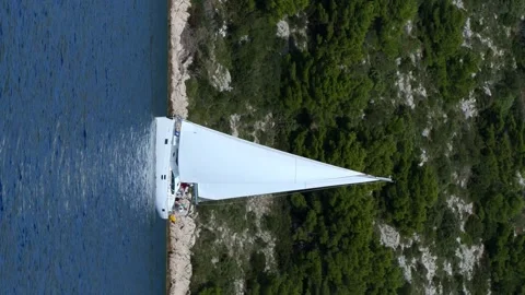 A sailboat is floating on the water Stock Footage 276071969