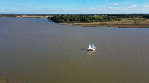 Sailboat in full sail on the river Stock Footage 221949746