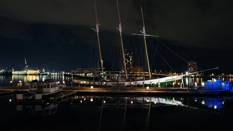 Sailboat in Harbor at Night with Reflection Stock-Footage 129856938