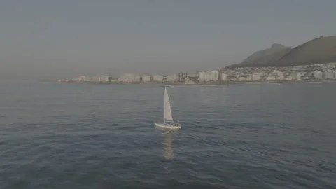 Sailboat with the iconic seapoint and Table Mountain in the background Stock Footage 317994967