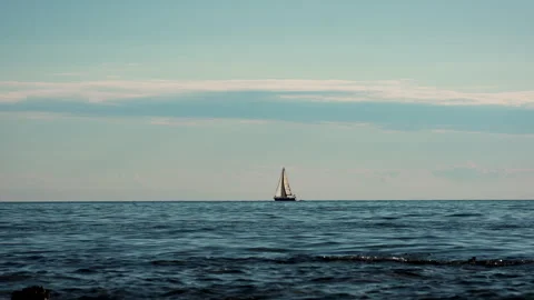Sailboat Leaving Frame on Lightly Wavy Sea Stock Footage 341668391
