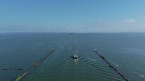Sailboat Leaving Harbor Between Breakwaters Stock Footage 339684326