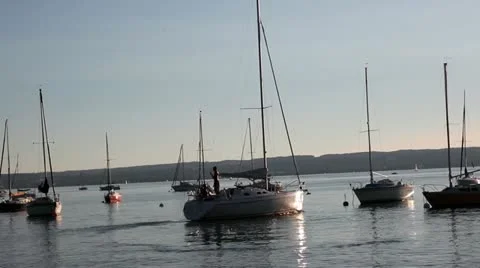 Sailboat leaving harbour Stock Footage 11948455