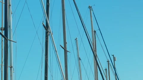 Sailboat masts and rigging against blue sky, marine and nautical background Stock Footage 334148333
