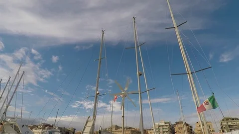 Sailboat Masts and a Wind Generator that rotates, at Harbor Stock Footage 71612841