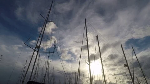 Sailboat Masts silhouette at Harbor with cloudy sky Stock Footage 71603353
