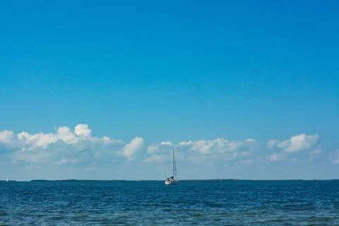 Sailboat in the middle of the ocean Stock Photos