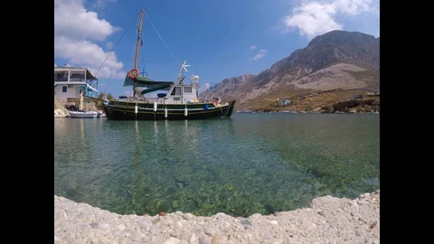 Sailboat moored in a small harbor Stock Footage 97896744