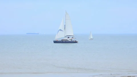 Sailboat navigating on the Atlantic Ocean off La Rochelle, France Stock Footage 242176331