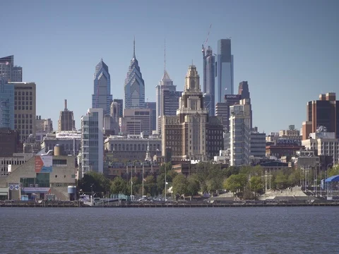 Sailboat passing on the delaware river in front of downtown philadelphia Stock Footage 84903134