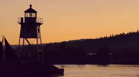 Sailboat Passing Lighthouse Stock Footage 9056370