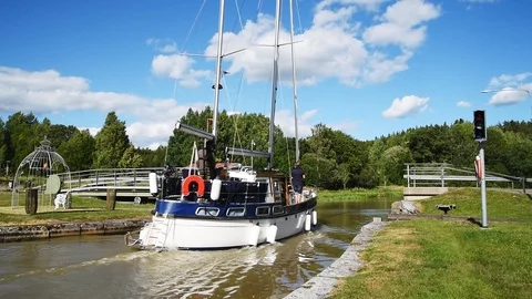 Sailboat passing retractable bridge Stock Footage 94565843