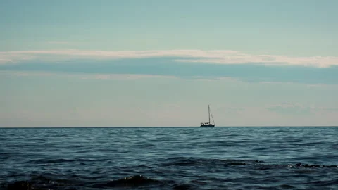 Sailboat Passing Through Light Waves – Seamless Continuation Stock Footage 341668019
