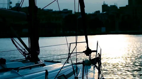 Sailboat on pier at sunset Stock Footage 74901427