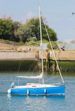 A sailboat powered by the force of the wind 1 Stock Photos