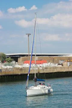 A sailboat  powered by the force of the wind 2 Stock Photos