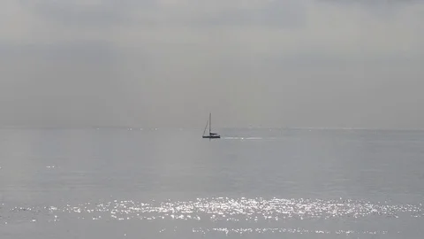 Sailboat propelled by the motor sails Stock Footage 83540650