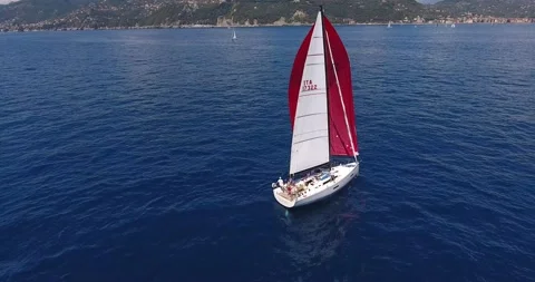 A sailboat red and white Stock Footage 137644428