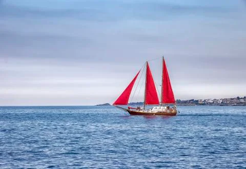 Sailboat with red sails Stock Photos