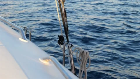 Sailboat rigging in front of small waves. Ropes and shrouds of a sailboat. Stock Footage 204922366