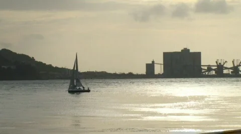 Sailboat on river at sunset Video stock 101016