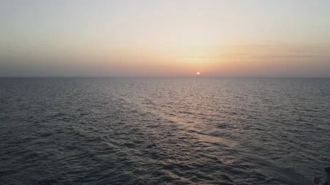 Sailboat sailing alone at sunset Stock Footage 167701807