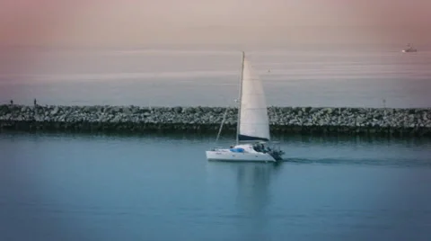 Sailboat sailing out of frame into the ocean Stock Footage 54566554