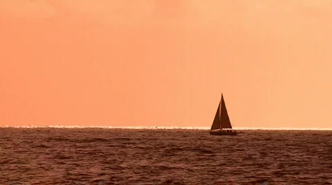 Sailboat sailing at sunset 動画素材 280212