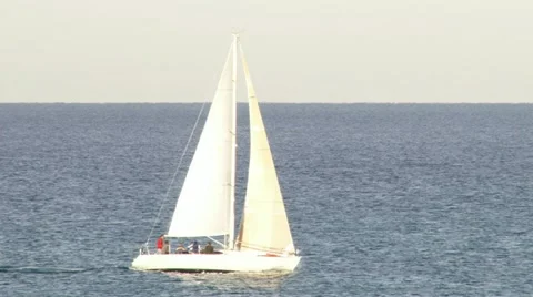 Sailboat sailing at sunset Stock Footage 20512907