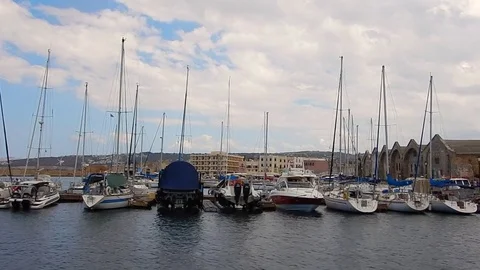 Sailboat sails in front of Hania Lighthouse near the old port, Crete, Greece Stock-Footage 77137992