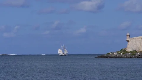 Sailboat schooner sailing next to Morro Castle fortress in San Juan Harbor. Stock Footage 70543772