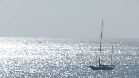 Sailboat in sparkling ocean Stock Footage 8679291