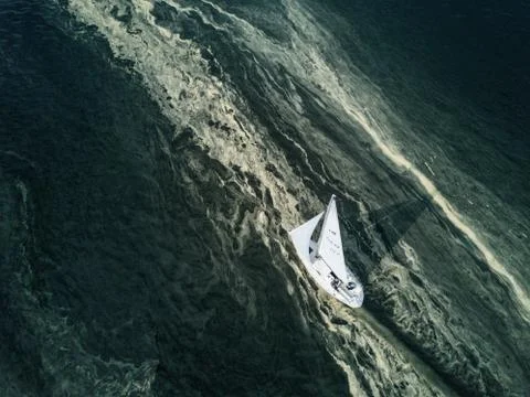 Sailboat in a stream of pollen Stock Photos